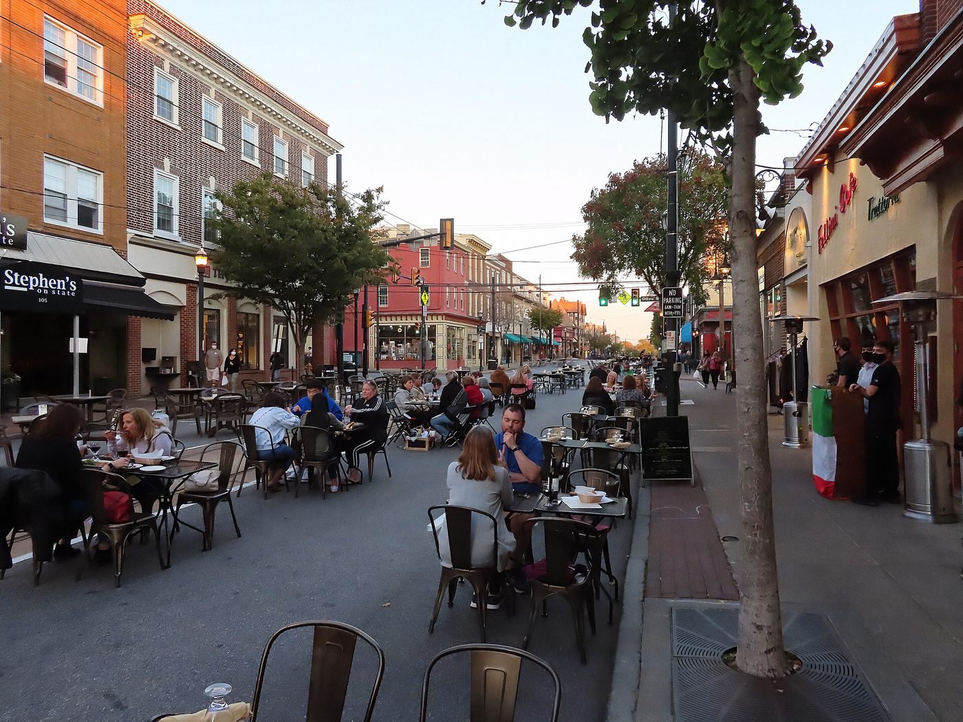 State Street in Media on an October afternoon, tables out on the pavement. The county seat, and where the deed gets recorded when this is all over.