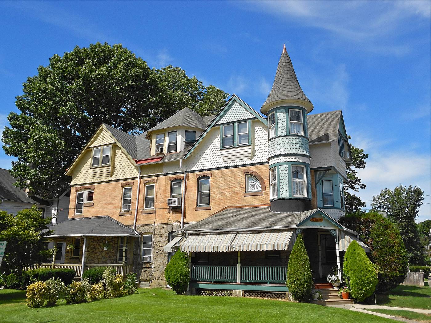 Two houses in the Lansdowne Park historic district. Turrets, wraparound porches, and a paint bill nobody warns you about.