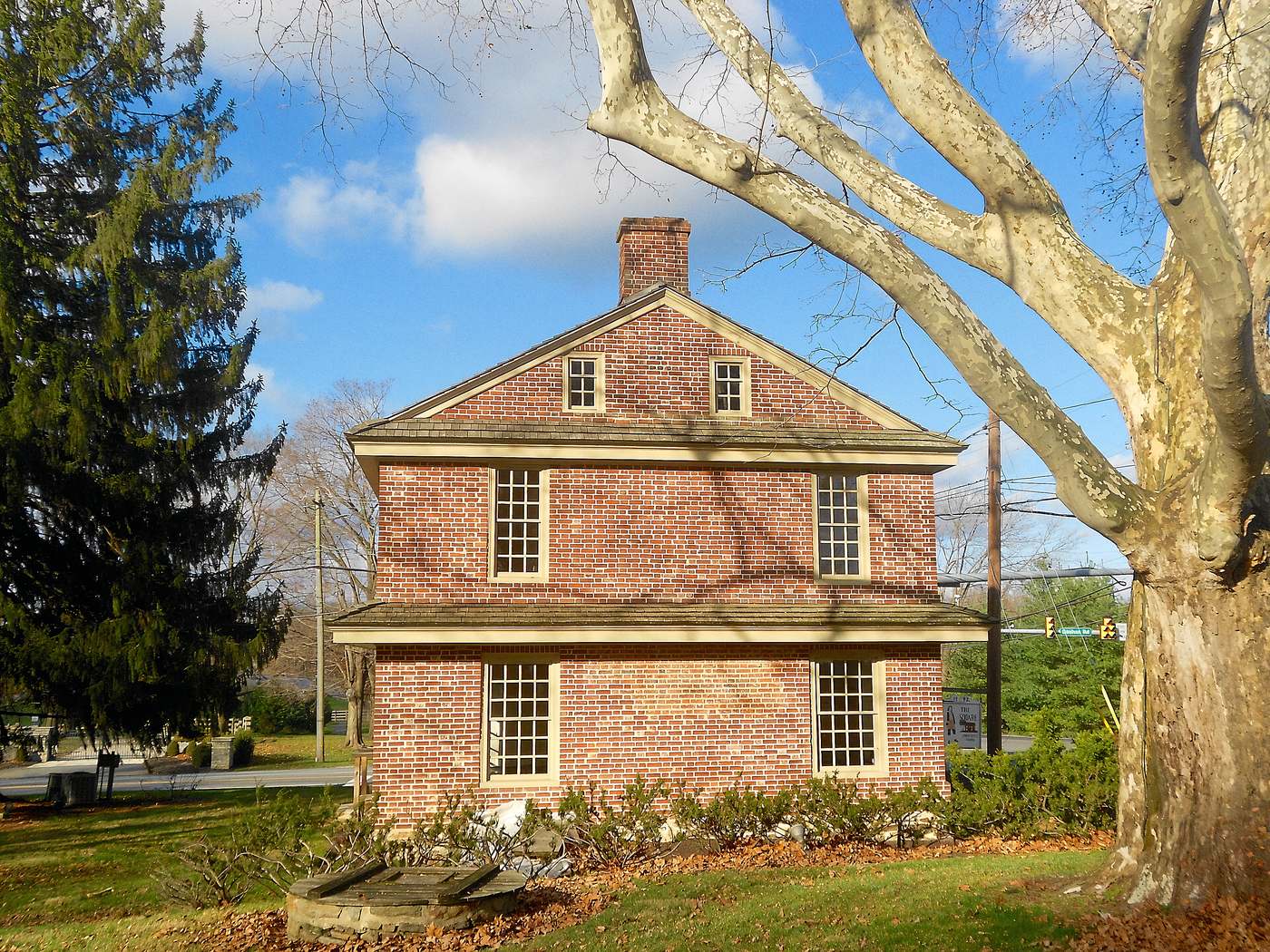 The Square Tavern at Newtown Square, also called the John West House. Brick, small windows, and a couple of centuries of Newtown Township around it.