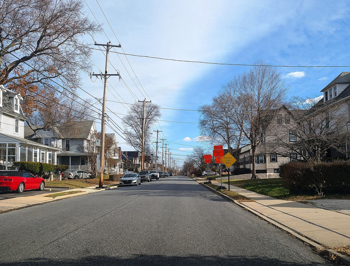 13th Avenue in Prospect Park. Porch-front singles and twins on both sides, which is the whole borough in one picture.
