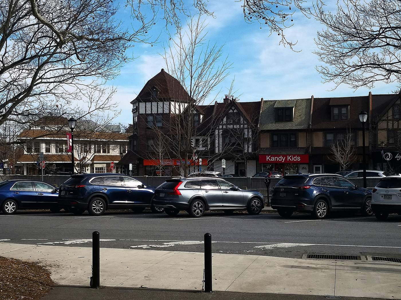 The Ville in Swarthmore from South Chester Road. Tudor shopfronts, the station a minute away, and the borough's own millage on top of the school district's.